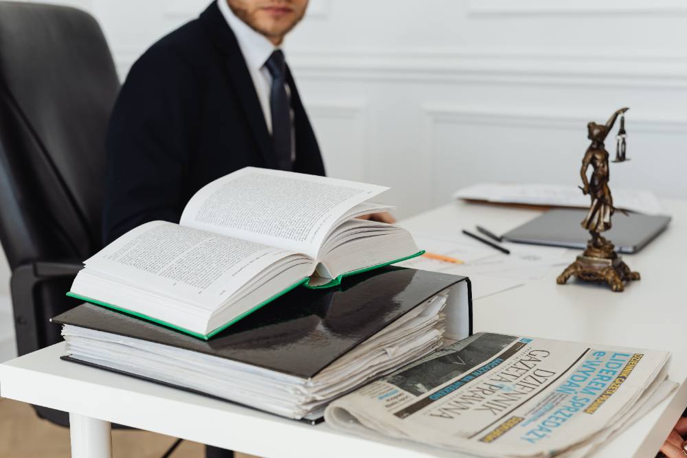 Attorney's desk with case files and law books