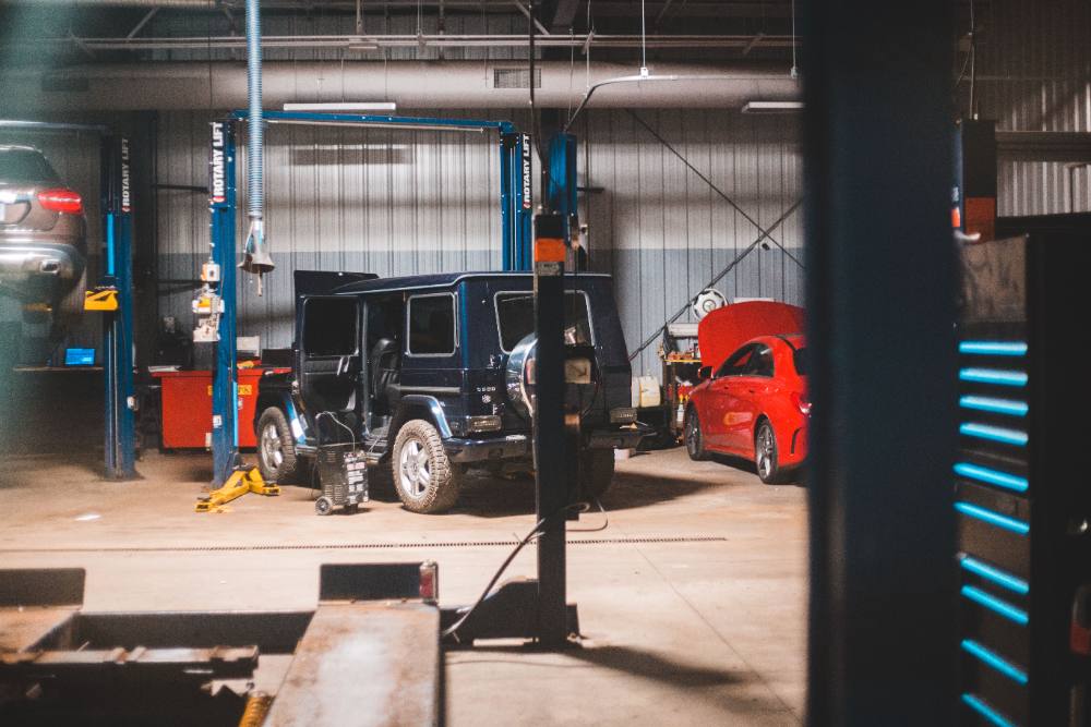 Collision repair shop with cars on lifts